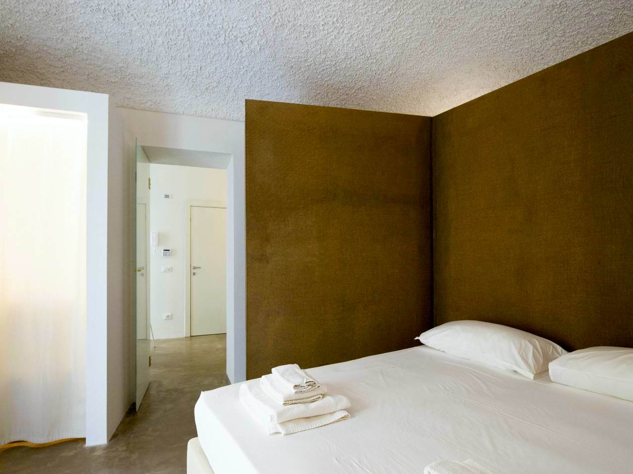 Refined details of the double bedroom of the Aurea apartment, Ortigia