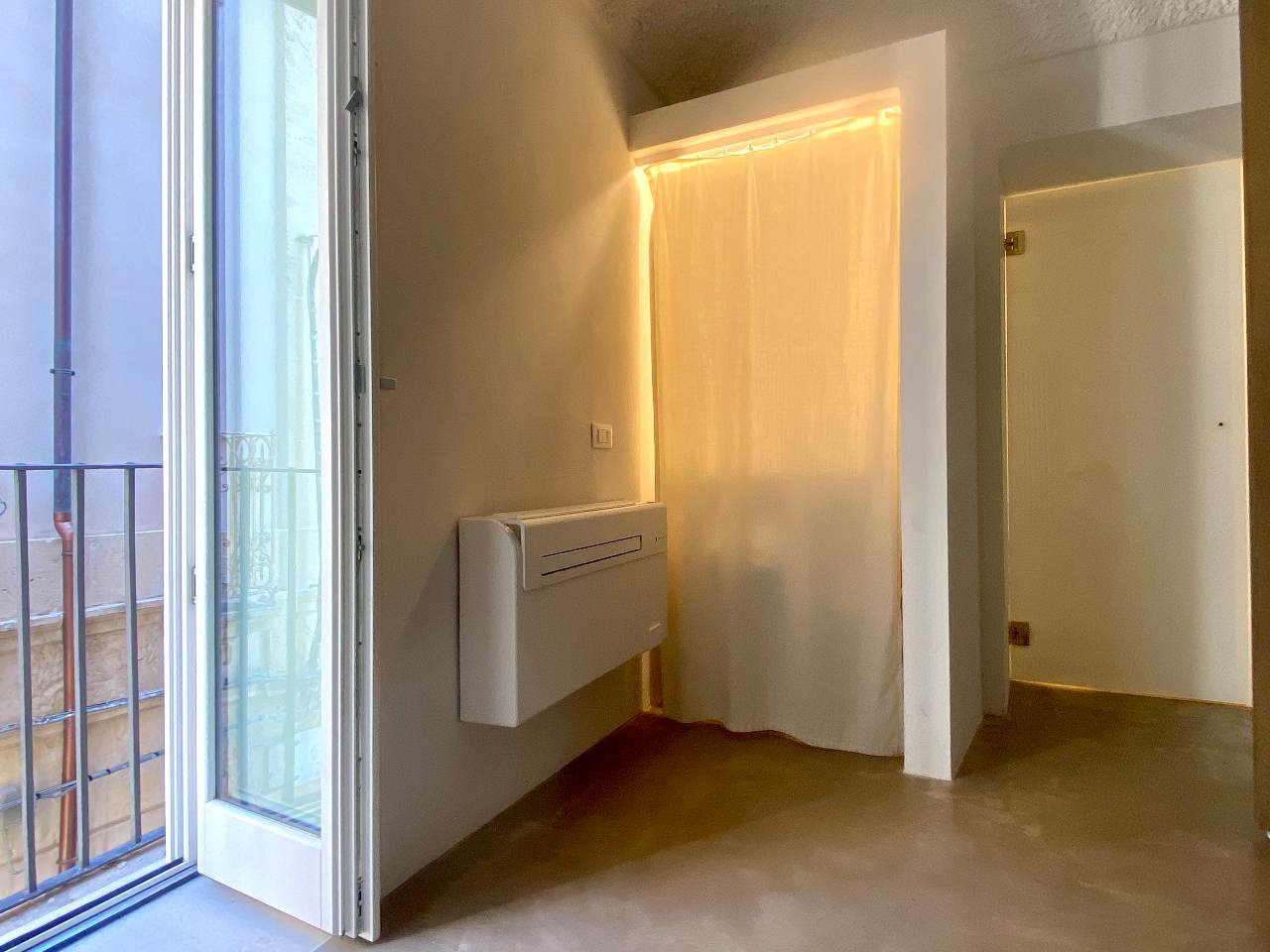 Cozy interiors of the double bedroom in Aurea apartment, Ortigia, Syracuse