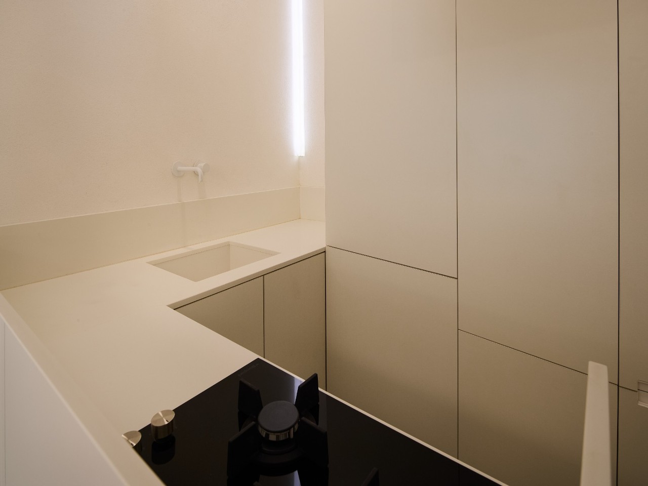 Cozy interiors of the modern kitchen in Aurea apartment, Ortigia, Syracuse