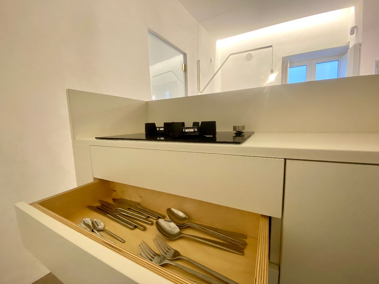 Modern and equipped kitchen of the Aurea apartment in Ortigia, Syracuse