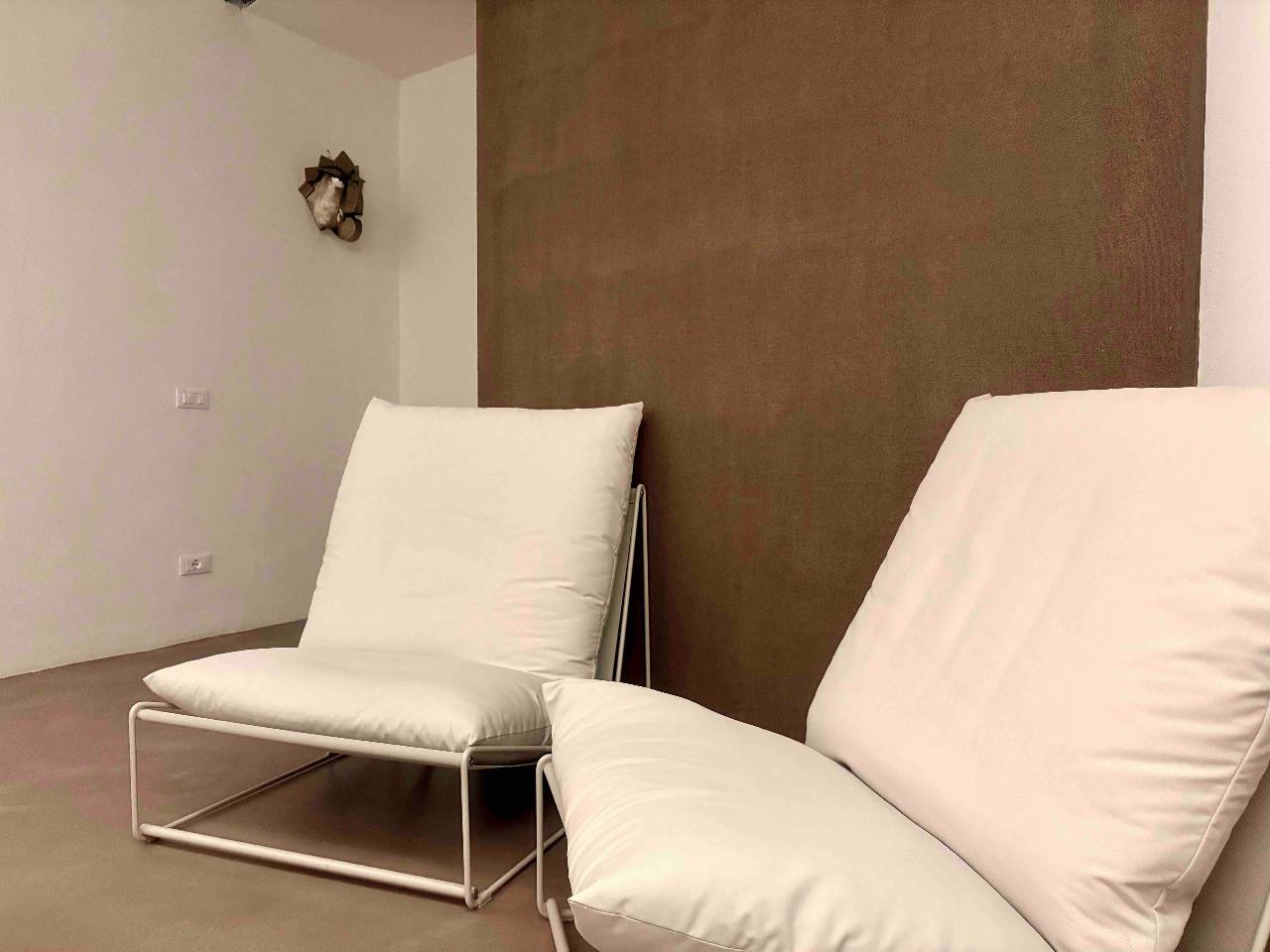 Modern living room with refined details in Aurea apartment, Ortigia, Syracuse