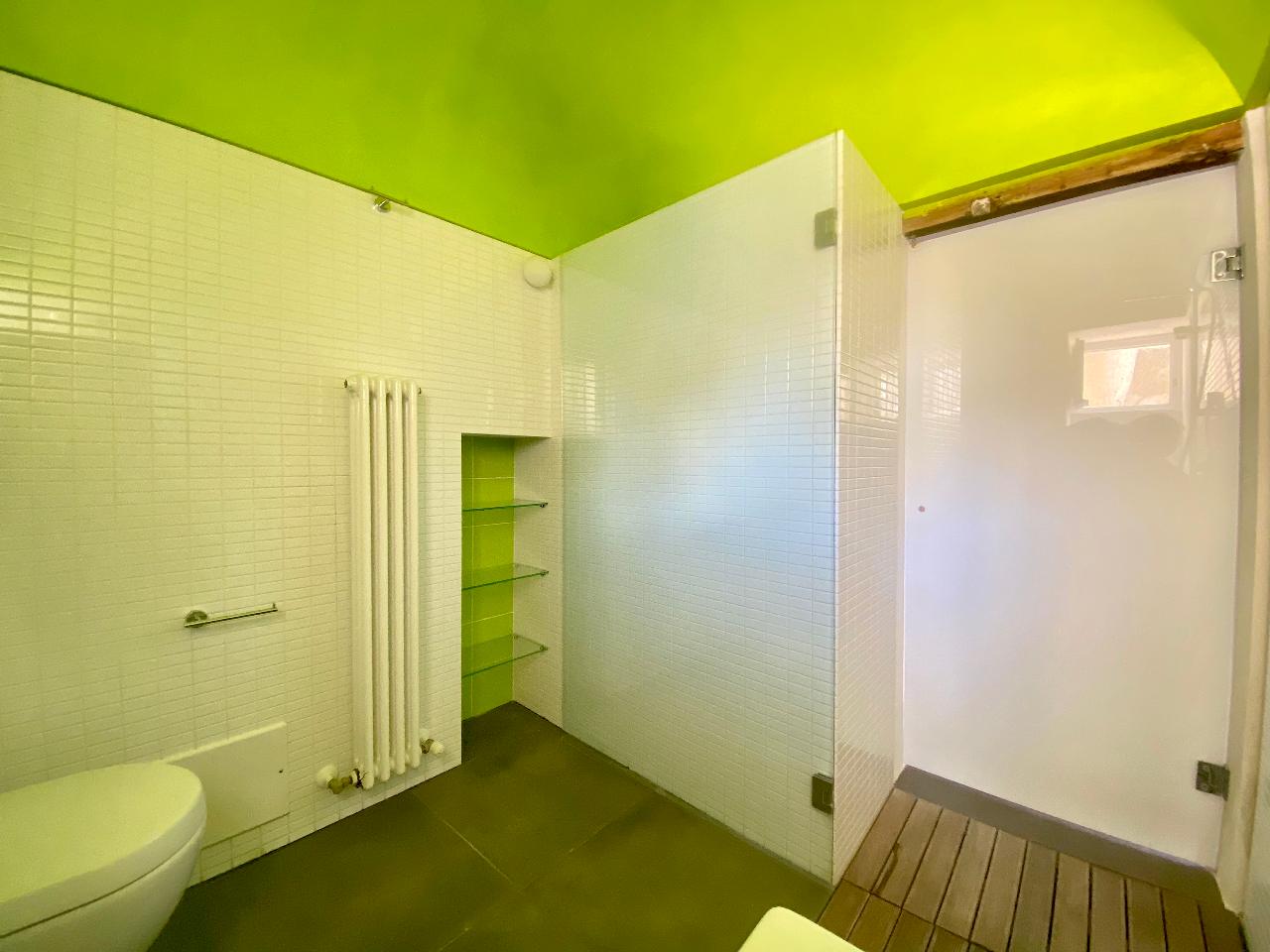Elegant bathroom with modern shower in the Kleomene apartment, Ortigia