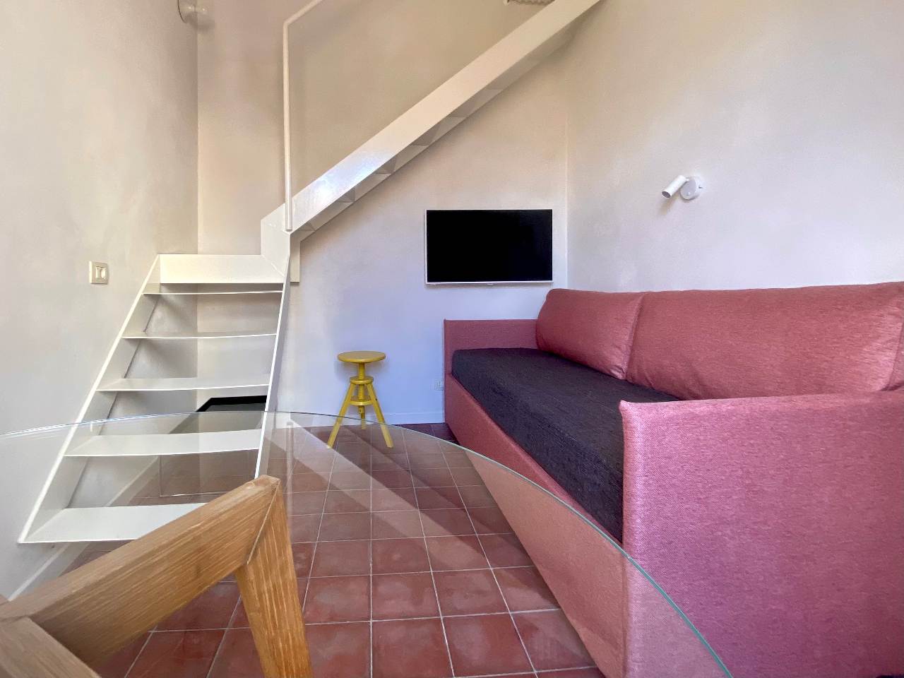 Modern loft bedroom of the Kleomene apartment in Ortigia, Syracuse