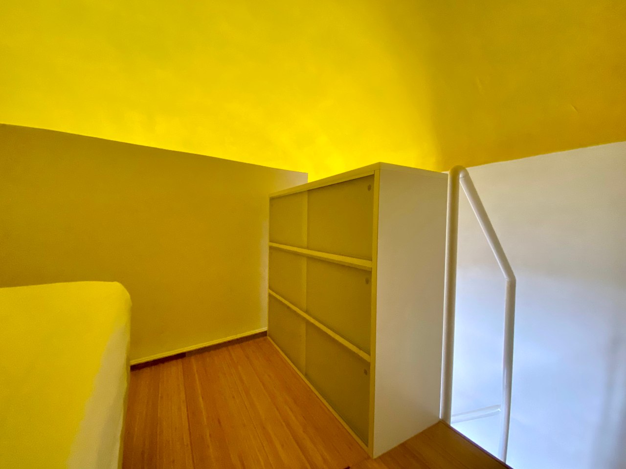 Modern interiors of the loft bedroom in Kleomene apartment, Ortigia, Syracuse