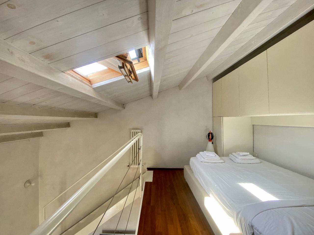 Spacious loft bedroom of the Kleomene apartment in the heart of Ortigia