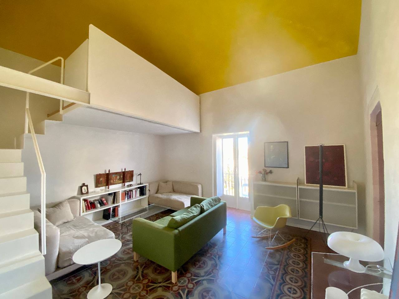 Spacious living room with modern furnishings in Kleomene apartment, Ortigia, Syracuse
