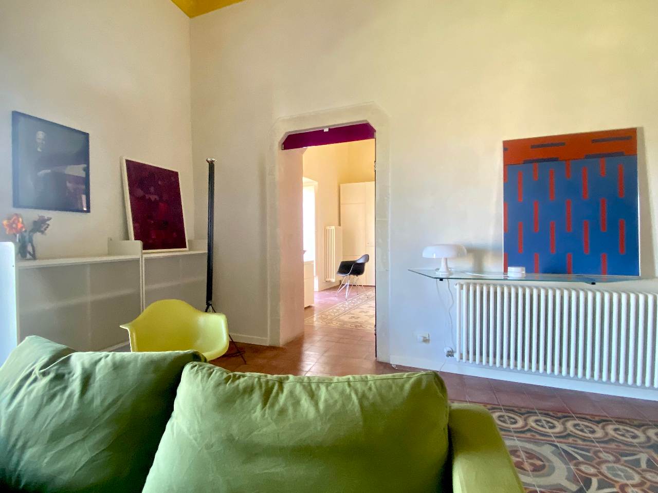 Elegant interiors of the spacious living room in Kleomene apartment, Ortigia