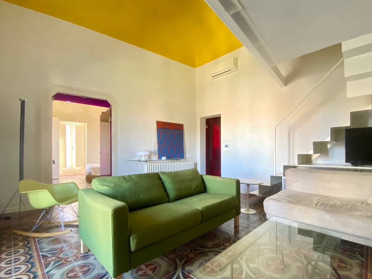 Cozy living room with modern details of the Kleomene apartment, Ortigia