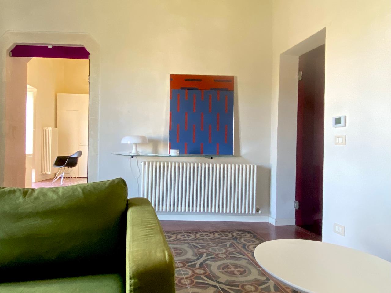 Spacious elegant living room of the Kleomene apartment in central Ortigia, Syracuse